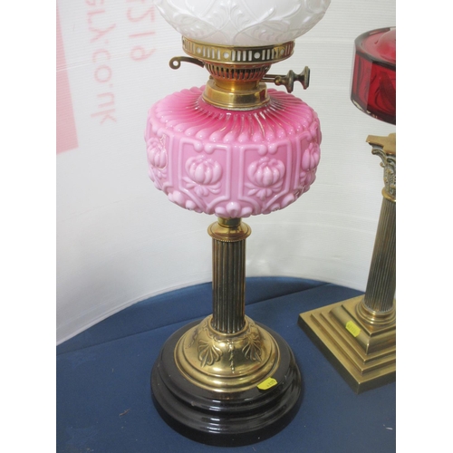 588 - Three brass Oil Lamps with glass reservoirs and shades