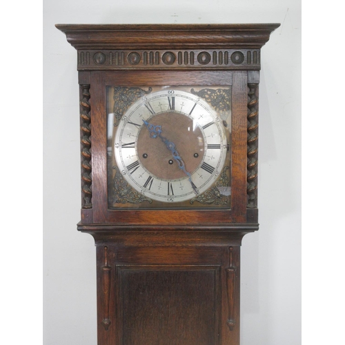 621 - A 20th Century oak Longcase Clock by Waring & Gillows, London with brass and silvered dial 6ft 2in H