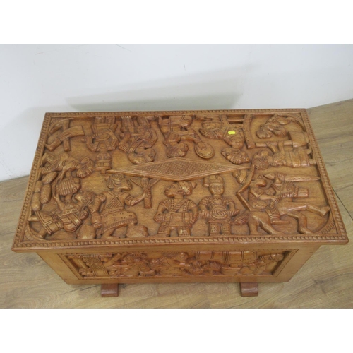 635 - An African hardwood Blanket Chest carved with panels of tribal figures 3ft 4in W x 1ft 7in H