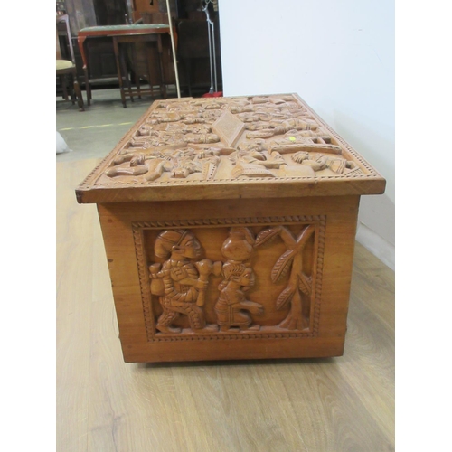 635 - An African hardwood Blanket Chest carved with panels of tribal figures 3ft 4in W x 1ft 7in H