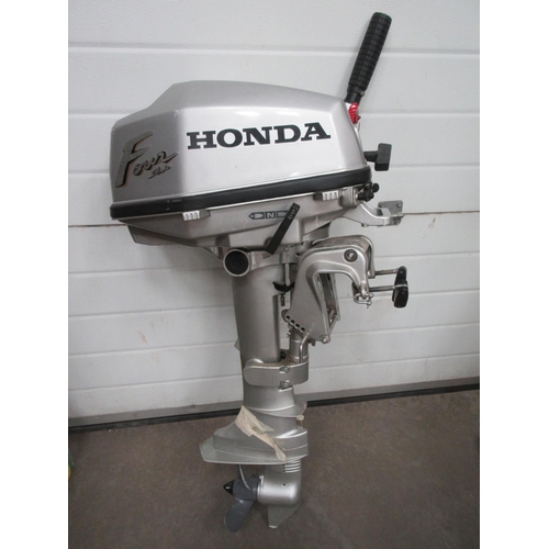 642A - A Honda 5hp Outboard Motor and Fuel Tank