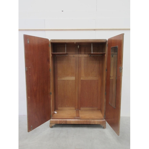 646 - A walnut two door Wardrobe enclosing hanging space (one handle missing) 3ft 10 W 6ft 2H