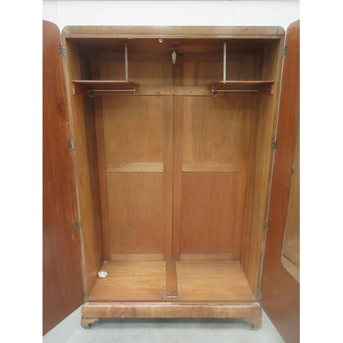 646 - A walnut two door Wardrobe enclosing hanging space (one handle missing) 3ft 10 W 6ft 2H