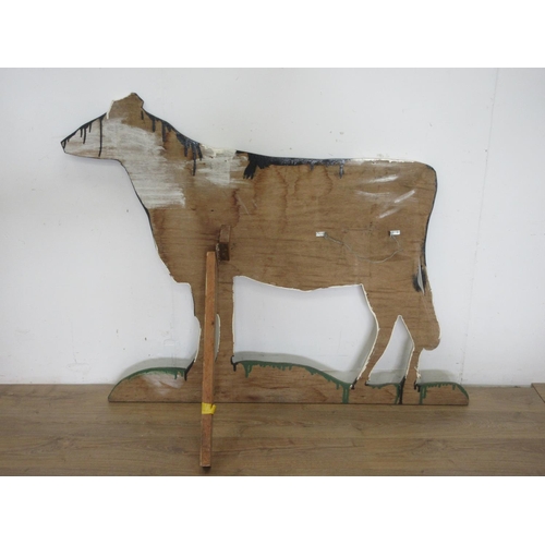 647 - A painted wooden cut out of a dairy Cow 4ft 8in W x 4ft 2in H