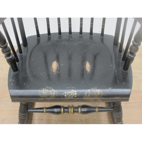 648 - A black painted stick back Boston Rocking Chair