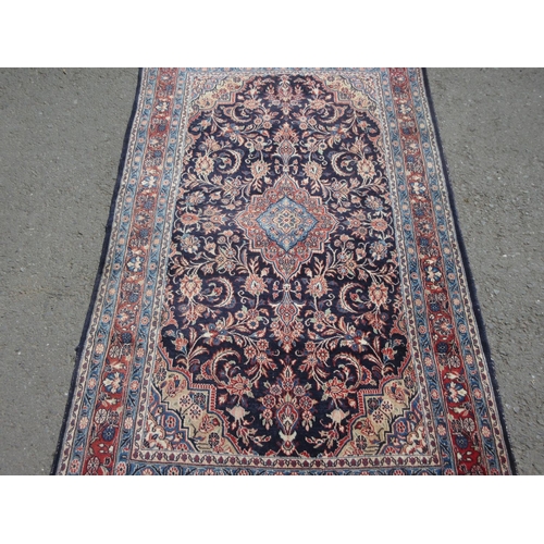 655 - A blue ground Rug with central lozenge within multiple borders 7ft x 4ft 5in