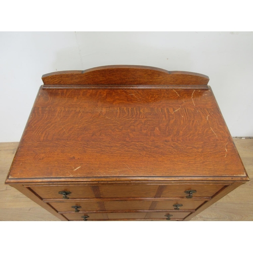 98 - An oak Chest of three long drawers on bun feet 3ft 1in H x 2ft 9in W