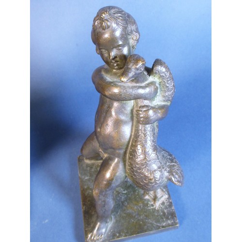 583 - A bronze Figure of a boy with goose and a plaster Figure of girl with child