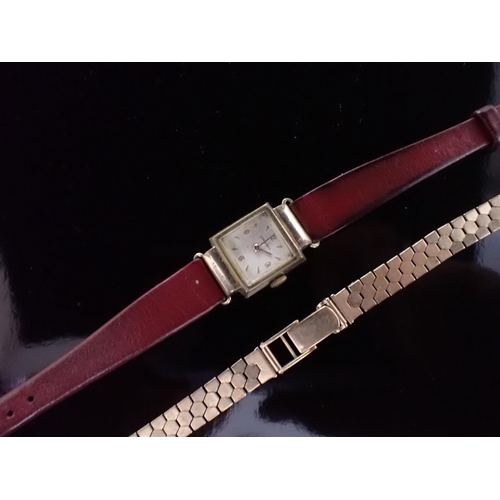 103 - A lady's Longines Wristwatch, the square dial with applied chevron markers and Arabic numerals at qu... 