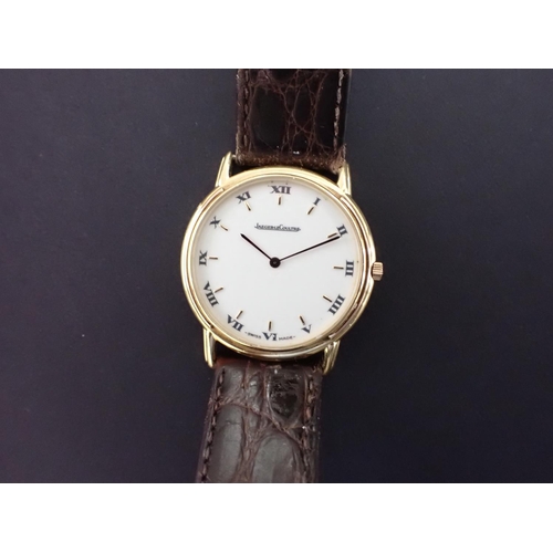 113 - A 1990's Jaeger le Coultre 'Odysseus' 18ct gold cased quartz Wristwatch, the cream dial with applied... 