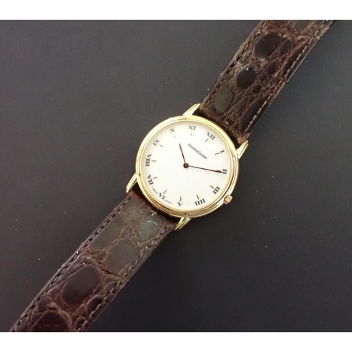 113 - A 1990's Jaeger le Coultre 'Odysseus' 18ct gold cased quartz Wristwatch, the cream dial with applied... 