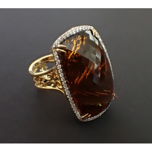 116 - A Citrine and Diamond Cocktail Ring corner claw-set very large rectangular multi-faceted citrine wit... 