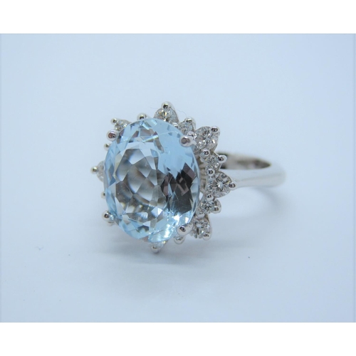 120 - An Aquamarine and Diamond Cluster Ring, claw-set oval mixed-cut aquamarine, 4.70cts, within frame of... 