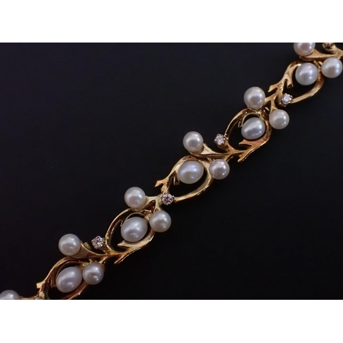 141 - A Cultured Pearl and Diamond Bracelet having irregular links each set three pearls and a single bril... 