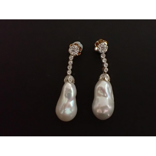 149 - A pair of Diamond and Cultured Baroque Pearl Earrings each claw-set cluster of eight brilliant-cut d... 