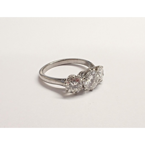 162 - A Diamond three stone Ring, claw-set graduated brilliant-cut stones, est. total diamond weight 1.90c... 