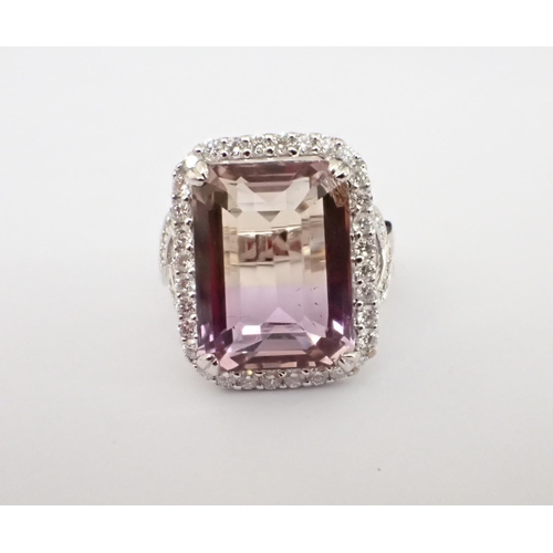 164 - An Ametrine and Diamond Ring corner claw-set step-cut ametrine within a frame of pavé-set brilliant-... 