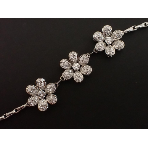 175 - A Diamond Daisy Chain Bracelet the front with three daisy links set numerous brilliant-cut stones, t... 