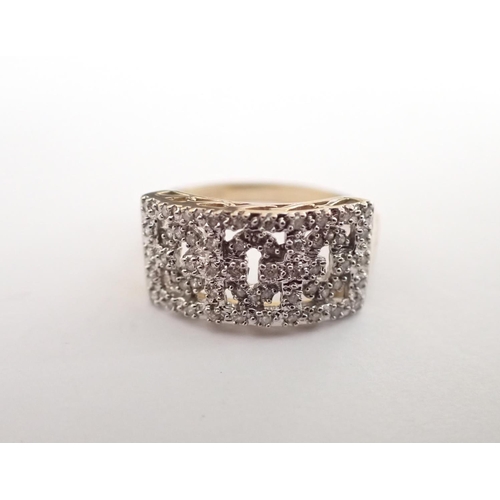 177 - A 9ct gold Dress Ring the front with pierced motif set numerous synthetic stones, ring size S