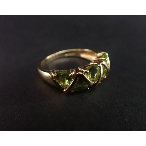 178 - A Peridot Ring claw-set six triangular-cut stones in 9ct gold, ring size R