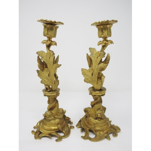 208 - A pair of ormolu Candlestick with figural columns of boy and girl winged cherubs on dolphin supports... 