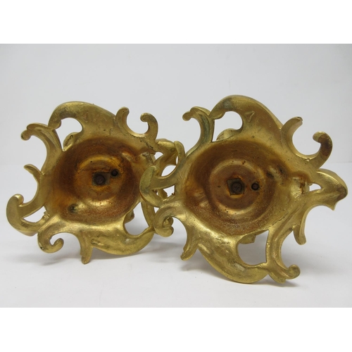 208 - A pair of ormolu Candlestick with figural columns of boy and girl winged cherubs on dolphin supports... 