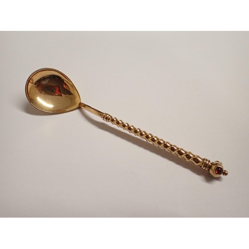 211 - A gold Spoon with pear shape bowl, spiral stem with knop finial set turquoise, ruby and emerald type... 