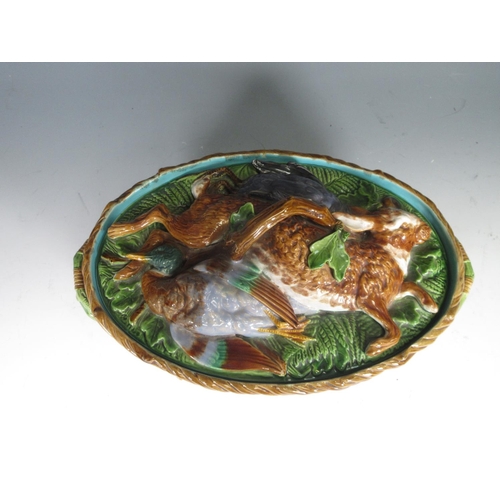 256 - A Minton majolica oval Tureen and Cover with moulded hare and duck lid, the basket weave moulded bas... 