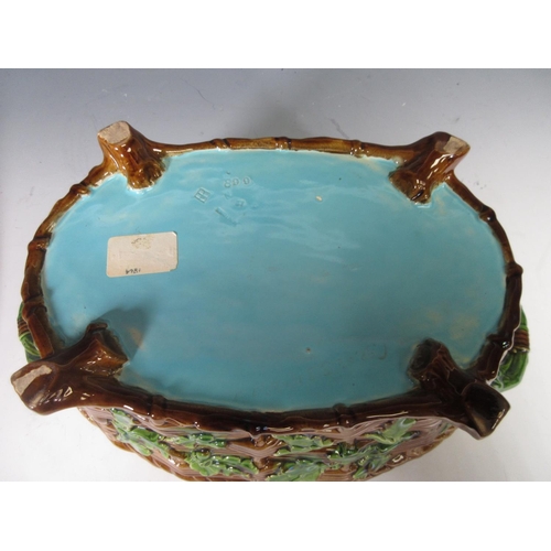 256 - A Minton majolica oval Tureen and Cover with moulded hare and duck lid, the basket weave moulded bas... 