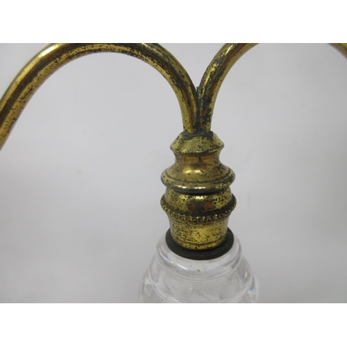 258 - A 19th Century brass and cut glass Clark's patent Candle Lamp with shaped brass arms holding the gla... 