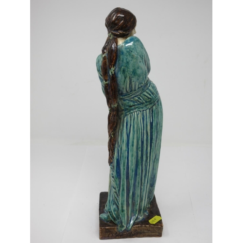 260 - An Art Nouveau style pottery Figure of standing female figure with long brown hair, turquoise glazed... 