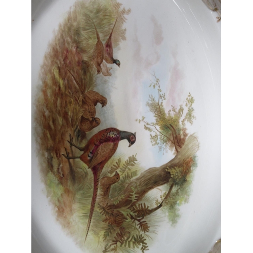 272A - A Royal Worcester service painted individual scenes with gamebirds, viz: Oval Platter with pheasant ... 