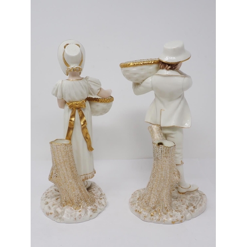 293 - A pair of Worcester Hadley standing figures of young lady and gentleman holding baskets with gilt de... 