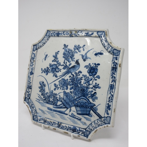 295 - An early 18th Century rare Delft blue and white Plaque with shaped corners, decorated bird and flora... 