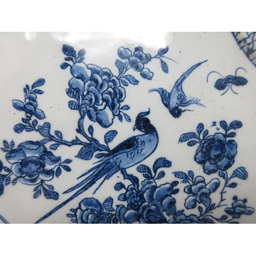 295 - An early 18th Century rare Delft blue and white Plaque with shaped corners, decorated bird and flora... 