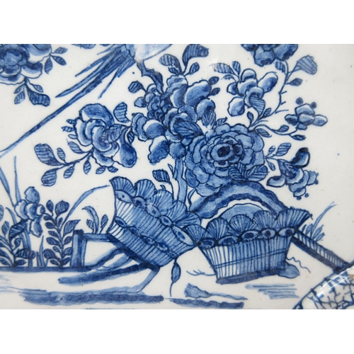 295 - An early 18th Century rare Delft blue and white Plaque with shaped corners, decorated bird and flora... 