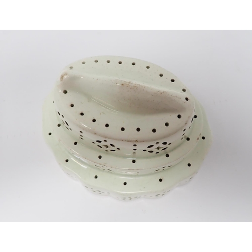 297 - A Creamware oval stepped Curd Mould with fish design to interior