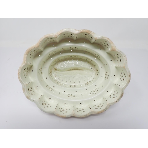 297 - A Creamware oval stepped Curd Mould with fish design to interior