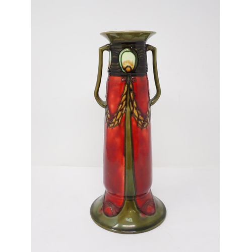 299 - A Minton Secessionist two-handled Vase with deep red and green tube lined decoration, by John Wadswo... 