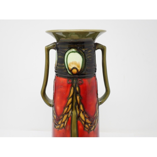 299 - A Minton Secessionist two-handled Vase with deep red and green tube lined decoration, by John Wadswo... 