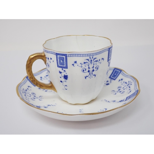 303 - A First Period Worcester Cup, Coffee Cup and Saucer, floral painted decoration, blue border with gil... 