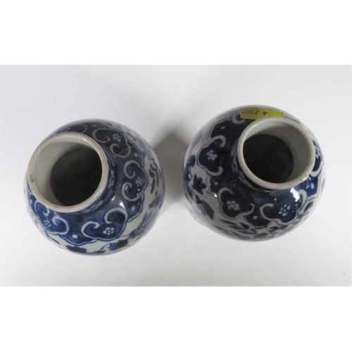 315 - A pair of 19th Century Chinese blue and white Vases of baluster form, decorated dragons and flowers,... 