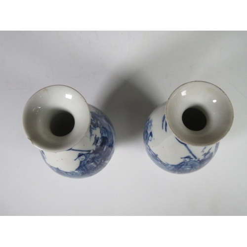 319 - A pair of 19th Century Chinese blue and white Vases of baluster form, decorated figures in a landsca... 