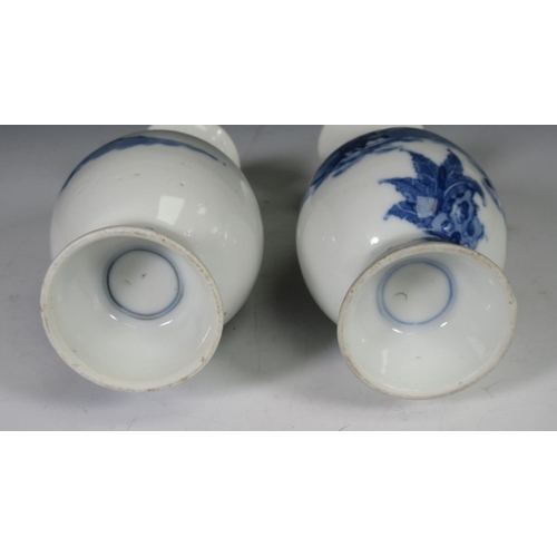 319 - A pair of 19th Century Chinese blue and white Vases of baluster form, decorated figures in a landsca... 