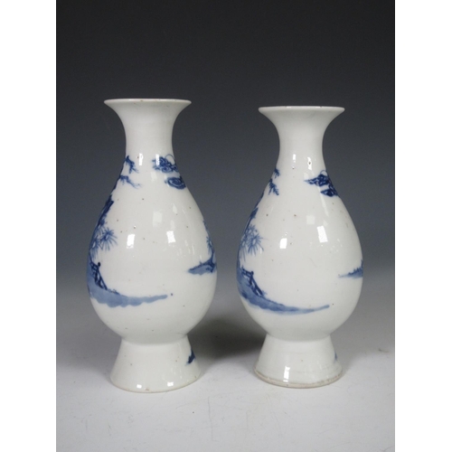 319 - A pair of 19th Century Chinese blue and white Vases of baluster form, decorated figures in a landsca... 