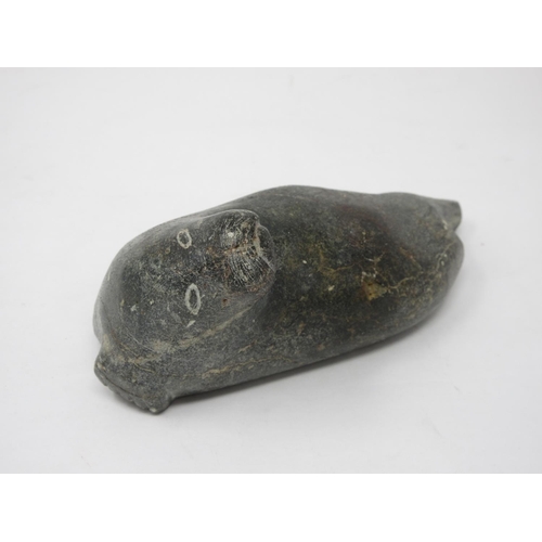 323 - An Inuit carved stone sculpture of a Walrus, scratch signed 'Jimmy' to underside 6 1/2in L