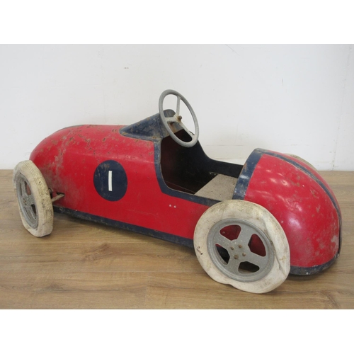 325 - A mid 20th Century Pedal Car with red and blue livery, with pneumatic tyres, requires some attention... 