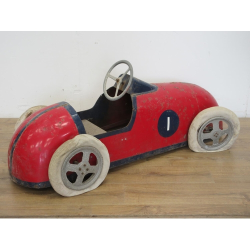 325 - A mid 20th Century Pedal Car with red and blue livery, with pneumatic tyres, requires some attention... 