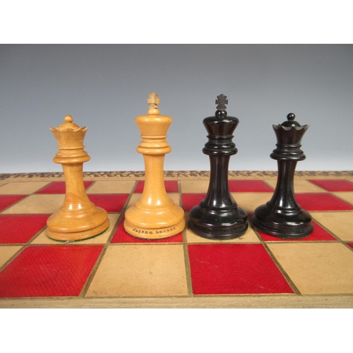 326 - A Staunton Chess Set by Jaques & Son, London with boxwood and ebonised pieces and including Moroccan... 