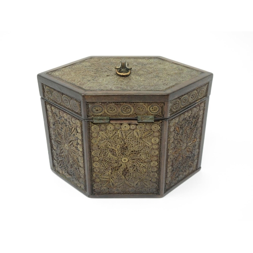 336 - A Georgian mahogany and rolled paper Tea Caddy of hexagonal form with circular convex glass covered ... 